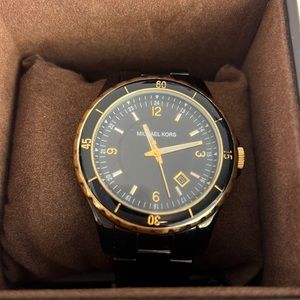 Michael Kors women’s Black and gold watch